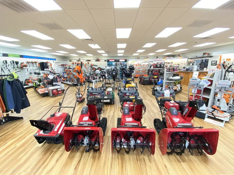 Row of red Honda snowblowers on the showroom floor